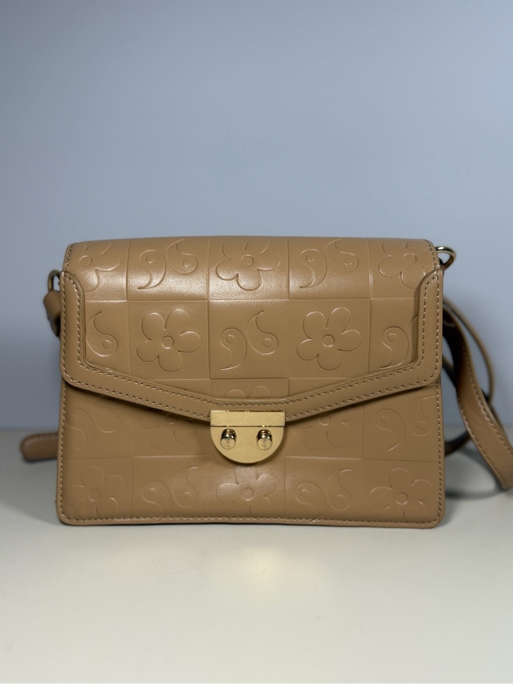 Embossed Floral Tan Crossbody Bag with Gold Lock